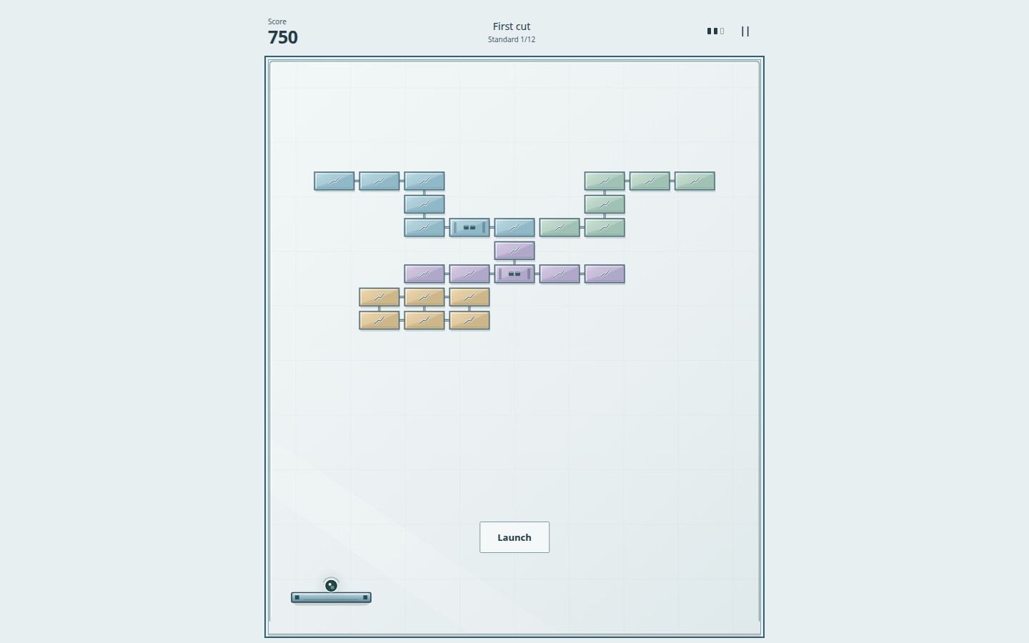 Brickwork in the Cut Glass world, board First cut: pale blue, green, lilac and sand glass bricks joined by thin links, the paddle at the lower left, score 750 and a Launch button